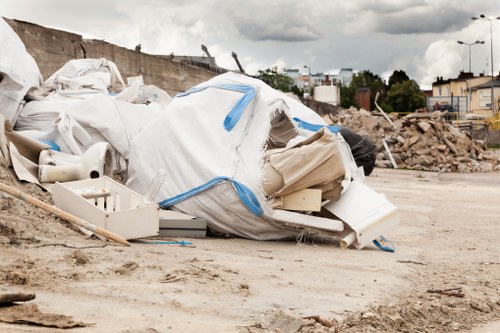 Skips lined up for collection on a busy Leyton street